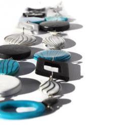 Long chunky necklace in electric blue, black and white.